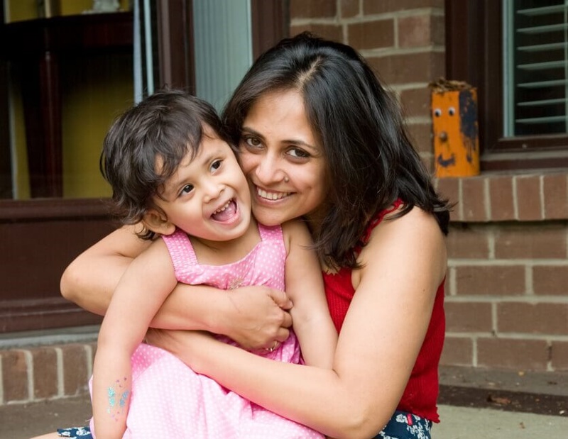 Banner 960 Woman Holding Child Smiling